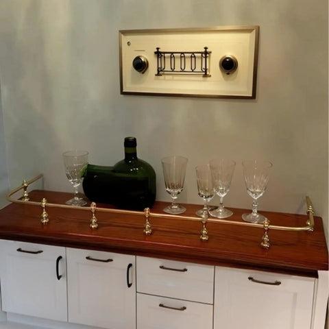 Kickass Gallery Rails For Shelves 3 Pack 15.7 Inch Aluminum Alloy Rods displayed on a wooden shelf with glassware.