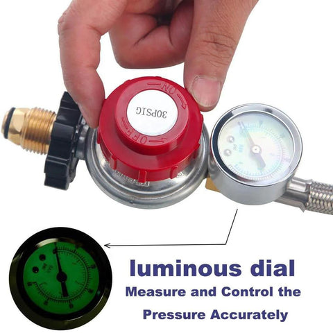 Propane regulator with gauge and red adjustment knob connected to stainless steel braided hose.