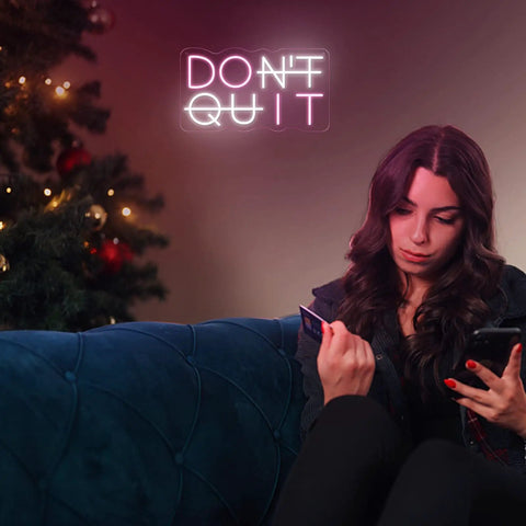 Dont Quit Neon Sign Do It LED Neon Light For Wall Decor USB Powered Adjustable Mood Lighting next to a woman on a couch