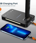 LED Desk Lamp With Wireless Charger And USB Port, Black Finish, charging phone on desk, side view