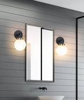 Two Pack Chic Modern Wall Sconces Matte Black And Gold With Milky Glass Globe Vanity Lighting in bathroom by mirror