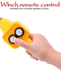 Premium Winch Handheld Control Assembly Replacement Remote Switch For 12V Electric Winches, yellow button controller in hand.