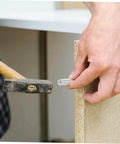 Person installing a stainless steel dowel pin into wood, demonstrating easy installation and precision alignment with tool.