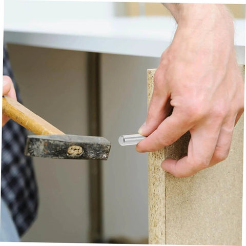 Person installing a stainless steel dowel pin into wood, demonstrating easy installation and precision alignment with tool.