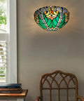 Soft Glow Tiffany Style Wall Sconce In Sea Green Stained Glass With One Light Vintage Victorian Ambience For Living Room Bedroom Hallway And Entryway Classic Cool Vibe For Cozy Homes, mounted on wall above chair