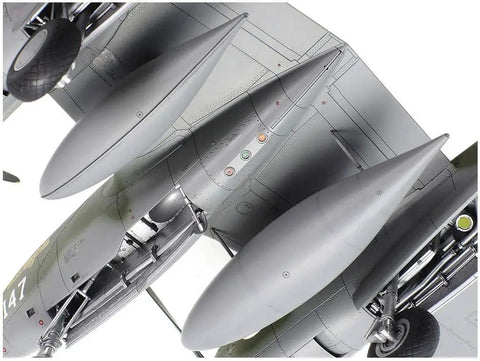 Detailed underside view of the 1 48 Scale Lockheed P 38 Lightning F And G Model Kit twin-boom fighter showing tanks and landing gear.