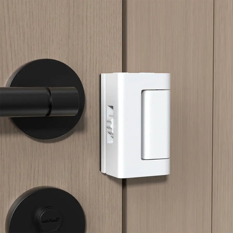 White Adjustable Portable Door Lock Rock Solid Security Reinforcement For Hotels Dorms Lock attached to wooden door.