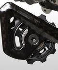 Close-up of the pulley system on an XTR Di2 Rd M9050 Rear Derailleur Black Medium Cage for trail and mountain bikes.