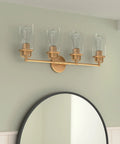 4 Light Vanity Light Wall Sconce In Champagne Bronze Finish With Clear Glass Lampshades, Gold Bathroom Fixture, mounted above mirror