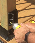 Person installing Beefy Sturdy 2x4 Railing Hangers For Wood Deck Railings Actual 1.5 x 3.5 Black Heavy-Duty Reinforced Polypropylene