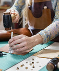 Person using 20 Piece Boot Hook Kit With Brass Shoelace Eyelets And Rivets, Press Stud Tools on leather surface