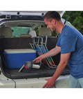 Man using Pivot Vac For Cars 12V DC Handheld Vacuum With Pivoting Nozzle Ten Settings Flex Crevice Tool in SUV trunk