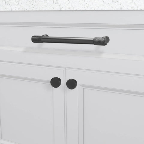 10 Pack Five Inch Matte Black Cabinet Handles Knurled Drawer Pulls For Cabinets Closets Drawers Dressers Doors And Kitchen Furniture Hardware installed on a white kitchen cabinet