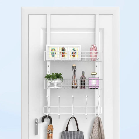 Over The Door Coat Rack With Mesh Basket And Detachable Storage Shelf, white finish, with various items, over a white door.