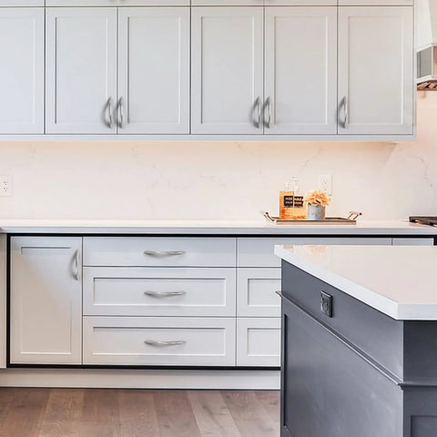 Modern kitchen with 10 pack brushed satin nickel arch twisted cabinet pulls 5 inch hole centers for cabinets and drawers handles installed.