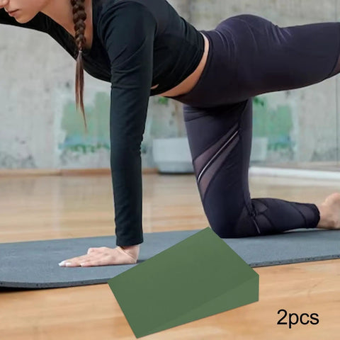Person exercising with Two Pack Foam Wedge Blocks Slant Boards Calf Stretcher EVA Lightweight Training Gear in green 12x15x5 cm.