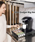 Woman using 36 Pod Coffee Pod Organizer K Cup Holder Drawer For Keurig And Dolce Gusto Capsules on kitchen countertop.