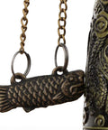 Vintage Bronze Dragon Lock Bell, Top Shelf Handcrafted Desktop Ornament With A Smooth Electroplate Finish, close-up of fish detail.