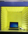 Solid Portable Desktop Soundproof Booth Cube Packed With Dense Acoustic Foam Panels For Dead Silent Mic Takes Home Studio Vocal Tracking And Room Noise Culling, featuring yellow foam and a laptop inside.