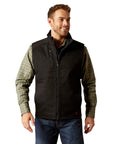 Men's Tough As Nails Fire Resistant Insulated Vest Black Large on model, featuring a zip closure and wind-blocking design.