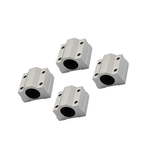 Four aluminum SCS-type linear bearing blocks with central round bore and two mounting holes