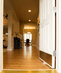 Interior view showing open door held by heavy duty wooden door stopper wedges, no slip design on wood floor for home use.