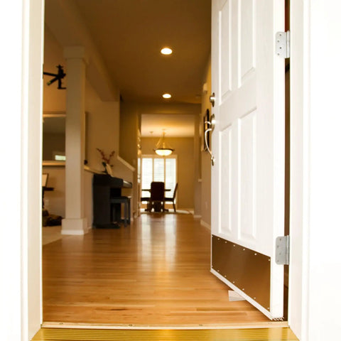 Interior view showing open door held by heavy duty wooden door stopper wedges, no slip design on wood floor for home use.