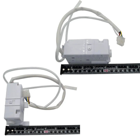Two DA59-00294A/B ice maker module replacements with 8-pin connector, next to measuring ruler for size reference.