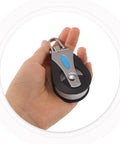 Person holding a Stainless Steel Marine Pulley Block With Nylon Bearing Wheel Swivel Sailing Gear for sailboats and yachts