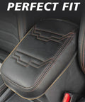 Nissan Frontier Center Console Armrest Cover That Fits 2022 2023 2024 2025 2026 With Vegan Leather Cushion Pad and Orange Trim, installed view.