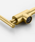 Close-up of gold pot filler faucet wall mount brass kitchen folding faucet with double joint swing arms and two handle design