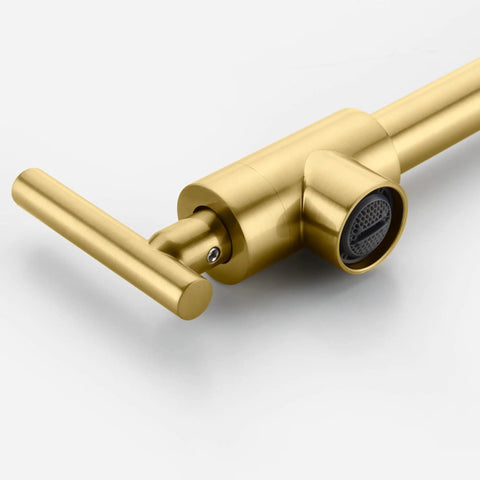 Close-up of gold pot filler faucet wall mount brass kitchen folding faucet with double joint swing arms and two handle design