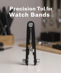 Metal Watch Band Removal Tool Kit with 8 Pins and Spring Bar Tool on a table, black, adjustable, for easy strap changes.