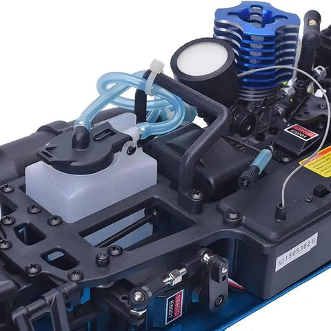 Close-up of Nitro RC Car One Tenth Scale For Adults 4WD Drifter engine and metal chassis, showing dual speed and methanol fuel setup.