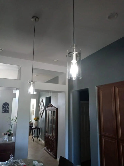 3 Pack Clear Glass Vintage Pendant Lights With Brushed Nickel Finish For Kitchen Island hanging in a home dining area