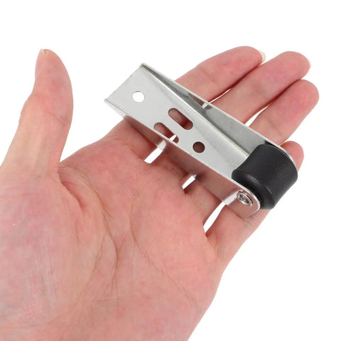 Heavy Duty 4 Pack Sliding Door Track Wheels With Hella Smooth Rolling Action And Four Hole Black Metal Casters For Closet Wardrobe Home Upgrades in hand showing size and design.