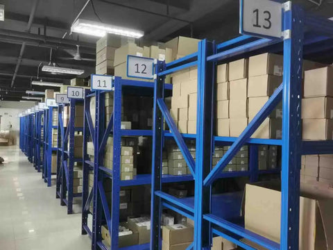 Warehouse shelves with boxes of Allen-Bradley 1734-IB8 Digital Input Module For PLCs 8 Point Sinking 24VDC Input Plug And Play