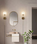 Gold Glass Globe Wall Sconces Set Of 2 Plug In Mid Century Modern Look for vanity bathroom with brass finish