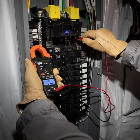 Clamp Meter Electrical Test Kit With Auto Ranging, Measures AC Current Up To 400 Amps, Backlit Display, in use on panel