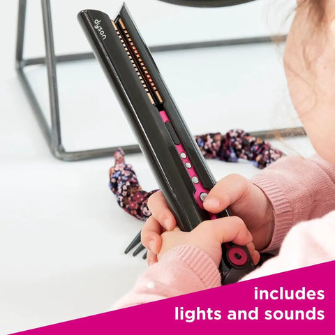 Child playing with Supersonic And Corrale Deluxe Styling Set Toy Straightener And Hair Dryer With Real Function For Kids 3 And Up