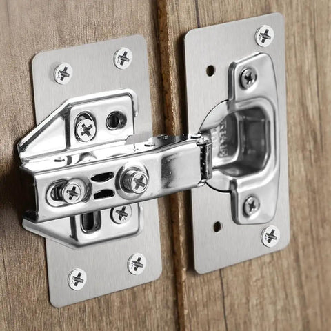 Close-up of All-In-One Stainless Steel Cabinet Hinge Repair Kit with side panel brackets and screws on wooden door cup base.