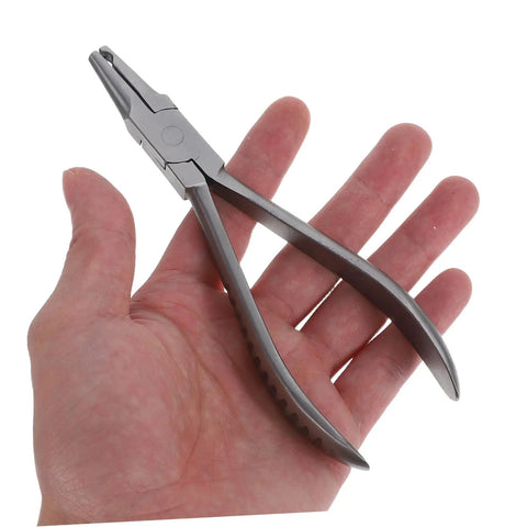 Hand holding Stainless Steel Eyeglass Repair Pliers With Nose Pad Tool 2 Piece Glasses Maintenance Kit For Quick Adjustments And Fixes Durable DIY Eyewear Repair Set For On The Go.