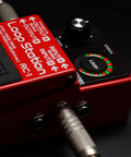 Compact Loop Pedal With 24 Segment Circular LED Indicator showing loop status on stage.