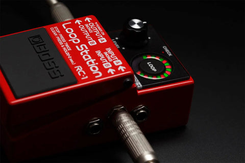 Compact Loop Pedal With 24 Segment Circular LED Indicator showing loop status on stage.