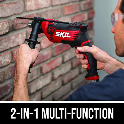 Tough As Nails Corded Hammer Drill With 100 Piece Bit Set, 7.5 Amp Variable Speed, Heavy Duty Gear For Wood Metal And Concrete, No Sweat Drilling, Pack Of 2 in action on brick wall.