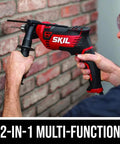 Person using 7.5 Amp Half Inch Corded Hammer Drill With 2 In 1 Drilling And Hammer Function High Torque Motor Heavy Duty Keyed Chuck