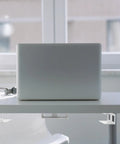 Premium Under Desk Laptop Stand Built Like A Tank With Solid Aluminum Bracket Mount Setup For A Super Sleek Office Workspace and Smooth Multi Device Storage, silver laptop mounted under desk.