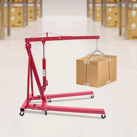 Tough as Nails Hydraulic Engine Hoist 1 Ton Cherry Picker Shop Crane with Smooth Rolling Wheels lifting a box.