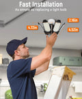 Man installing LED Garage Light 2 Pack Super Bright 20000 Lumens Ceiling Lighting With 6 Plus 1 Deformable Panels E26 Screw In Socket