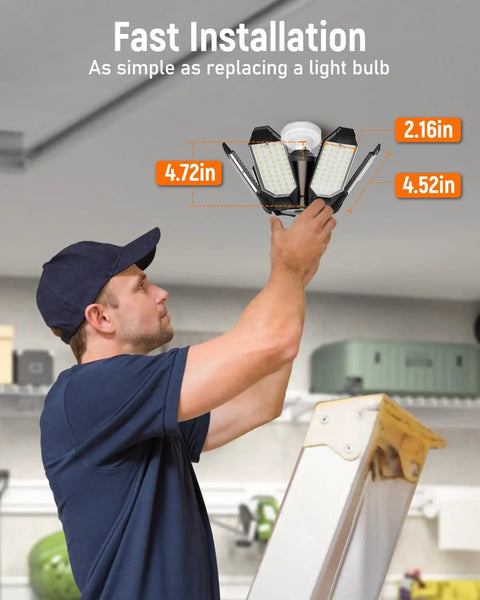 Man installing LED Garage Light 2 Pack Super Bright 20000 Lumens Ceiling Lighting With 6 Plus 1 Deformable Panels E26 Screw In Socket